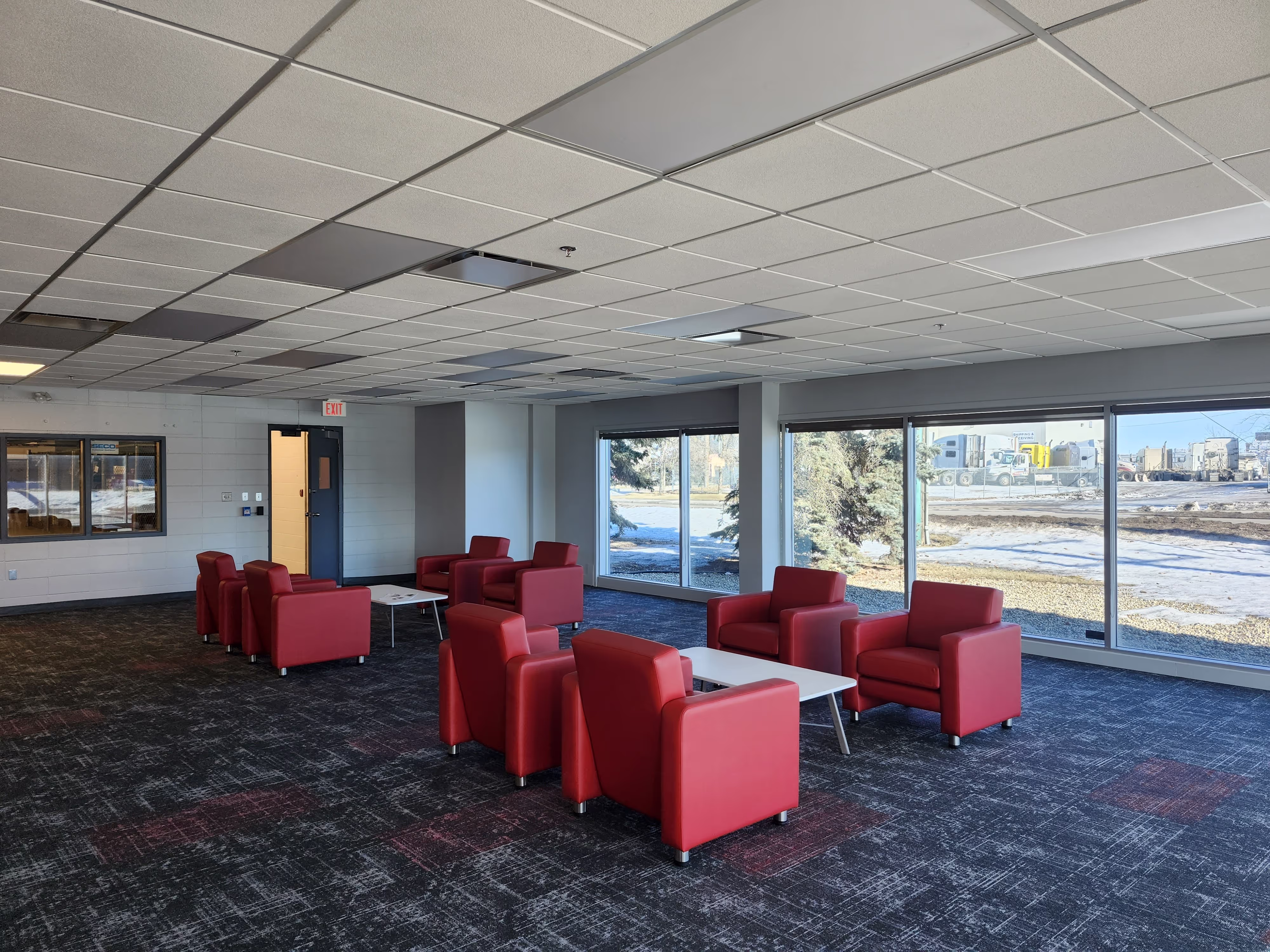 Completed Curtiss-Wright workplace lounge with red seating