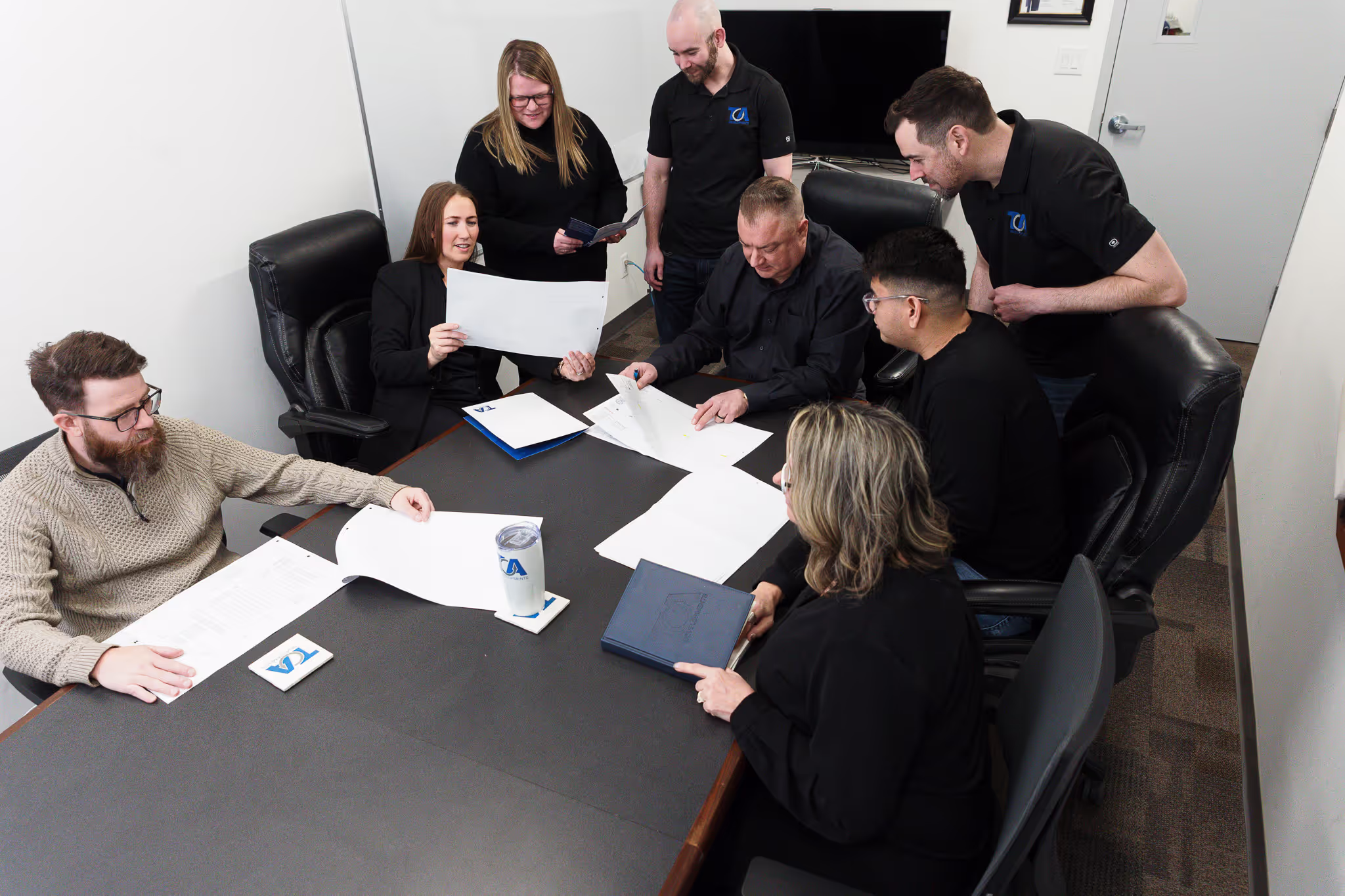 The TCA team reviewing project plans